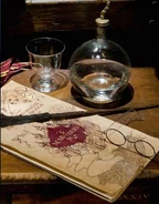 The Marauder's Map with Harry Potter's wand and spectacles