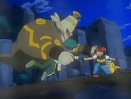 EP559 Dusknoir protegiendo a Ash y a Angie