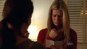5x11-carole-holds-aaron-picture