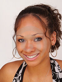Young-teen-black-girl-smiling-portrait-thumb3867807