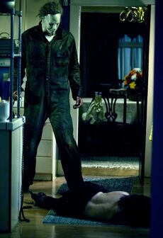 Michael stands over Annie