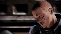 An injured Blue Suns mercenary