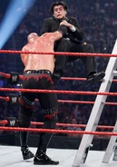 Kane chokeslam Alberto Del Rio's announcer