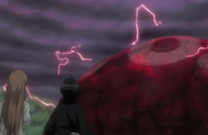Rukia and Orihime watch as Muramasa goes out of control