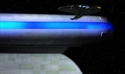 Ro's ship taking up position between the nacelles of the USS Enterprise-D