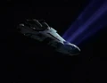 Ktarian starship in tractor beam.jpg