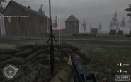 Troops positioned near sandbags Approaching Hill 400 CoD2