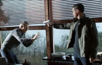 Sylvane holding flynn at gunpoint