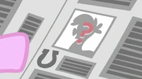 Question mark on a pony on a newspaper S2E23