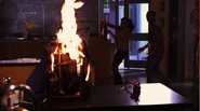 Alli grabbing fire-extinguisher