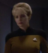 Female ensign in cargo bay 5, 2370