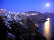 Moonrise over santorini greece