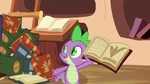 Spike showing the book to the ponies S3E05