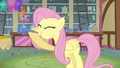 Fluttershy blowing knotted party horn S03E13.png