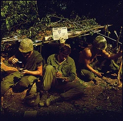 Three Liberation Army of Vermont soldiers, wearing stolen New England helmets and gear