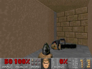 A chainsaw in a suspiciously empty passage on MAP08: Tricks and Traps.