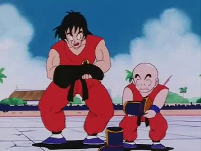 Yamcha_And_Krillin_Lifts_Goku%27s_Weigtted_T-Shirt_And_Boot.JPG