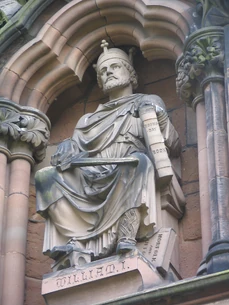Statue of William the Conqueror|, holding Domesday Book on the West Front of Lichfield Cathedral.