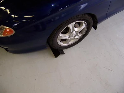 Place wheel chocks in front of vehical