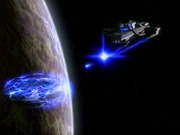 The Delta Rana warship firing a beam of jacketed antiprotons and positrons.
