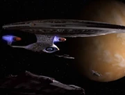 The USS Enterprise-D in orbit of Qualor II