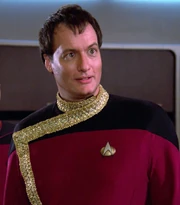 Q's version of a Starfleet admiral's dress uniform
