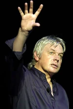 David Icke giving a speech.