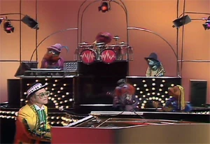 The Electric Mayhem provides back-up to Elton John