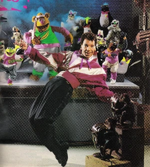 Michael Peters dancing with the Muppets
