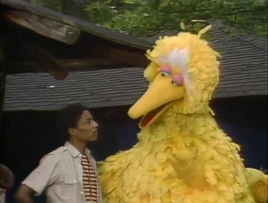 Giancarlo Esposito as Mickey, pictured with Big Bird