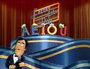 Guy announces the five finalists: A, E, I, O, and U.