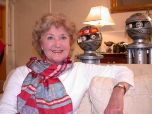 Denise Bryer, posing with robots from Terrahawks