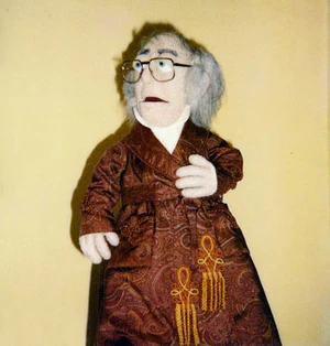 Caricature puppet of Michael Caine as Scrooge.