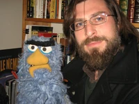 Jonathan Frith with the "Beautiful Day" puppet he made at age twelve at the Muppet Shop.