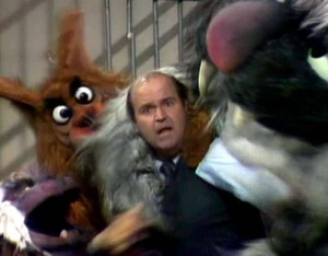 DeLuise is set upon by monsters.