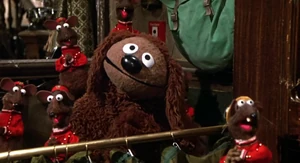 Rowlf sings a line of "Happiness Hotel".