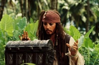 Jack Sparrow opens the Dead Man's Chest containing Davy Jones' heart.