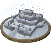 The snow globe contains a "snow"-covered model of Lumbridge Castle.