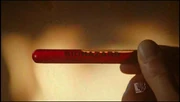Milton Fine holding the blood sample