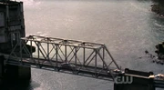 Lex tries to leave the dam through the bridge, but is confronted by police.