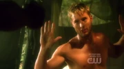 Oliver protects Tess from armed men.