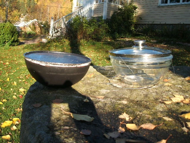 Black pot and glass bowl with lids
