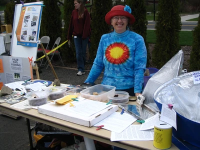 Sharon brings sunshine to a cloudy, windy day at Washington State University's 2009 Earth Day celebration, aided by solar candy samples and cookies made earlier in the week.