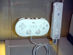 The Classic Controller connected to an early model of the Wii Remote.
