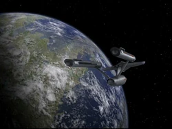 The USS Enterprise orbits Deneva during the neural parasite crisis in 2267.