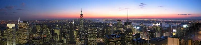 Panoramic image looking south from the upper deck of the 'Top of the Rock' observation deck on Rockefeller Center. Lower deck is visible on the right edge of the frame.