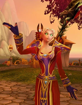 A female Blood Elf mage in magister's gear with the Staff of the Shadow Flame.