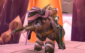 A draenei riding his Elekk mount.
