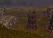 Orc peons shuffle about Go'shek Farm