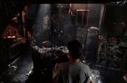 Mulder surveying burn damage to the X-files office in 1998.